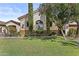 A green front yard with lawn and shade trees frames this lovely single-story home at 211 W New Dawn Dr, Chandler, AZ 85248