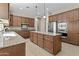 Large kitchen with stainless steel appliances, granite counters, and ample storage at 211 W New Dawn Dr, Chandler, AZ 85248