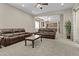 Inviting living room with comfortable seating, neutral carpet, and an open layout to the kitchen at 211 W New Dawn Dr, Chandler, AZ 85248