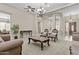 Bright living room with plush carpet, neutral walls, and designer furniture at 211 W New Dawn Dr, Chandler, AZ 85248