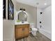 Renovated bathroom with shower-tub combo, modern vanity, updated fixtures, and new flooring at 2123 E Radcliffe Dr, Tempe, AZ 85283