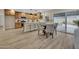 Eat-in kitchen with wood cabinets, stainless appliances, and breakfast bar overlooking the backyard at 2123 E Radcliffe Dr, Tempe, AZ 85283