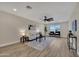 Bright living room features wood floors, neutral walls, an area rug, comfortable furniture and large picture window at 2123 E Radcliffe Dr, Tempe, AZ 85283