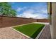 Exterior view shows artificial turf surrounded by rock at 22568 E Rosa Rd, Queen Creek, AZ 85142