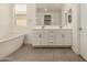 Bright bathroom featuring soaking tub, dual sink vanity, and neutral tones at 22568 E Rosa Rd, Queen Creek, AZ 85142