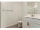 This is a bathroom with gray tile, a white vanity, and a sliding glass shower door at 22568 E Rosa Rd, Queen Creek, AZ 85142
