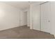 Bedroom with carpet and closet at 22568 E Rosa Rd, Queen Creek, AZ 85142