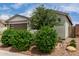 Exterior showcasing desert landscaping, rock mulch and a charming single-story facade at 22568 E Rosa Rd, Queen Creek, AZ 85142