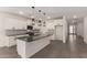 Bright kitchen with white cabinetry, granite counters, mosaic backsplash and stainless appliances at 22568 E Rosa Rd, Queen Creek, AZ 85142