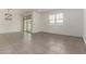 Bright open-concept living area with backyard access and modern light fixture at 22568 E Rosa Rd, Queen Creek, AZ 85142