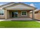 Exterior shows a patio with sliding glass door and an attached lawn area at 22568 E Rosa Rd, Queen Creek, AZ 85142