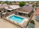 Aerial shot showcasing a home with a sparkling pool, patio, and neatly landscaped backyard at 2395 E Hancock Trl, Casa Grande, AZ 85194