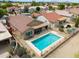 From above: Home with pool, backyard patio, desert landscaping, and community views at 2395 E Hancock Trl, Casa Grande, AZ 85194