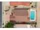 Birds eye view of a home with a tile roof, pool and neutral desert landscaping at 2395 E Hancock Trl, Casa Grande, AZ 85194