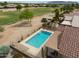 Stunning aerial view of a home's backyard oasis, featuring a pool and well-maintained greenery at 2395 E Hancock Trl, Casa Grande, AZ 85194