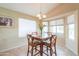 Cozy dining area with natural light and a view of the outdoor pool at 2395 E Hancock Trl, Casa Grande, AZ 85194