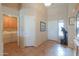 Inviting entryway with tile flooring, showcasing the laundry room and front door at 2395 E Hancock Trl, Casa Grande, AZ 85194