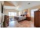 Spacious main bedroom with ceiling fan, tile flooring, and lots of natural light at 2395 E Hancock Trl, Casa Grande, AZ 85194