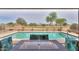 Backyard swimming pool and golf course views as seen from covered patio at 2395 E Hancock Trl, Casa Grande, AZ 85194