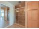 Close-up of tile shower with glass door and built-in shelving at 2395 E Hancock Trl, Casa Grande, AZ 85194