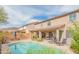 Backyard pool with patio, seating, desert landscaping and covered patio at 28136 N 90Th Ln, Peoria, AZ 85383
