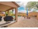 Backyard area with BBQ, patio table, desert landscaping and patio at 28136 N 90Th Ln, Peoria, AZ 85383