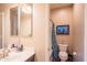 Well-lit bathroom featuring a vanity and shower at 28136 N 90Th Ln, Peoria, AZ 85383