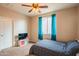 Cozy bedroom with carpet flooring, ceiling fan, and natural light at 28136 N 90Th Ln, Peoria, AZ 85383