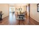 Spacious dining area features wood floors, a decorative chandelier, and access to other rooms at 28136 N 90Th Ln, Peoria, AZ 85383