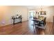Open dining space shows wood floors and table with views of connected living spaces at 28136 N 90Th Ln, Peoria, AZ 85383