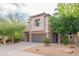 Charming two-story home featuring a tile roof, desert landscaping, and a two-car garage at 28136 N 90Th Ln, Peoria, AZ 85383