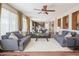 Bright living room with hardwood floors and multiple sofas at 28136 N 90Th Ln, Peoria, AZ 85383