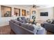 Comfortable living area features a stone fireplace and stylish decor at 28136 N 90Th Ln, Peoria, AZ 85383