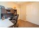 Cozy office space with built-in shelves and a comfortable desk area, great for working from home at 28136 N 90Th Ln, Peoria, AZ 85383