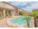 Backyard pool with palm trees and lounge chairs near the house at 28136 N 90Th Ln, Peoria, AZ 85383