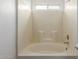 Neutral toned bathroom featuring a tub and shower combo with a tiled surround at 40427 N Orkney Way, San Tan Valley, AZ 85140
