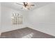 Bedroom showcasing carpet, ceiling fan and decorative millwork at 40427 N Orkney Way, San Tan Valley, AZ 85140