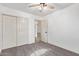 Carpeted bedroom with a ceiling fan and access to the rest of the house at 40427 N Orkney Way, San Tan Valley, AZ 85140