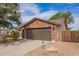Charming single-Gathering home with brick accents, two-car garage, and well-maintained front yard at 40427 N Orkney Way, San Tan Valley, AZ 85140