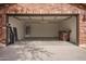 Spacious two car garage with ample storage space, bright lighting, and neutral colored walls at 40427 N Orkney Way, San Tan Valley, AZ 85140