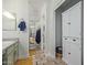 Bright bathroom featuring a linen closet and sink with decorative tile flooring, creating an organized space at 4771 E Meadow Land Dr, San Tan Valley, AZ 85140