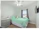 Bedroom with a ceiling fan, dresser, and a view of the outside at 4771 E Meadow Land Dr, San Tan Valley, AZ 85140