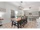 Open dining room with a large table, slider to the patio, and kitchen views at 4771 E Meadow Land Dr, San Tan Valley, AZ 85140