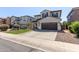 Delightful two-story home with a manicured front lawn and a spacious driveway at 4771 E Meadow Land Dr, San Tan Valley, AZ 85140