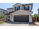 Attractive two-story home featuring a tile roof, shutters, and an attached two-car garage at 4771 E Meadow Land Dr, San Tan Valley, AZ 85140
