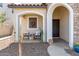 Welcoming front porch with cozy seating and charming seasonal decor at 4771 E Meadow Land Dr, San Tan Valley, AZ 85140