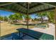 Park picnic area with sheltered table, bench, and view of the playground and community at 4771 E Meadow Land Dr, San Tan Valley, AZ 85140