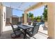Covered patio with dining table overlooking backyard and pool at 4771 E Meadow Land Dr, San Tan Valley, AZ 85140