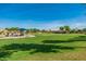 Community playground with play structure in a grassy park at 4771 E Meadow Land Dr, San Tan Valley, AZ 85140
