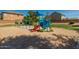 Community playground equipment includes swings and a colorful play structure with slides at 4771 E Meadow Land Dr, San Tan Valley, AZ 85140